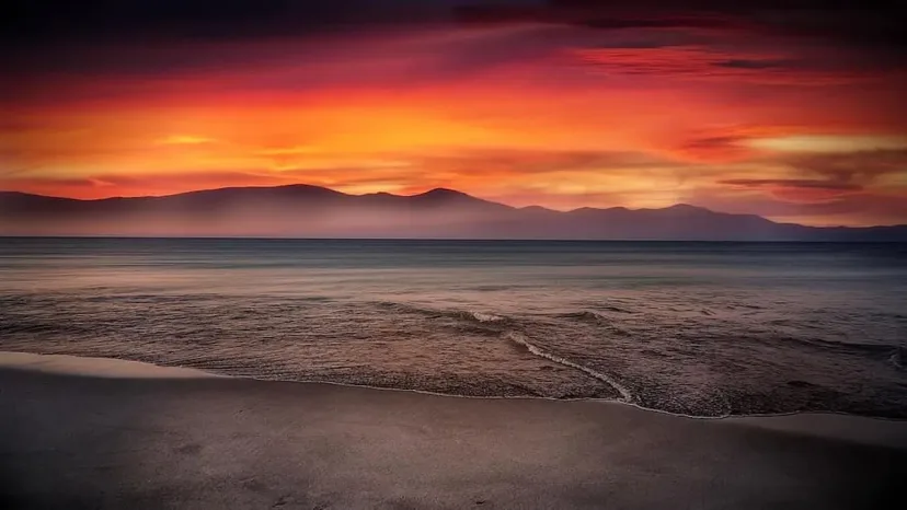 Sunset over a wide dry lake bed