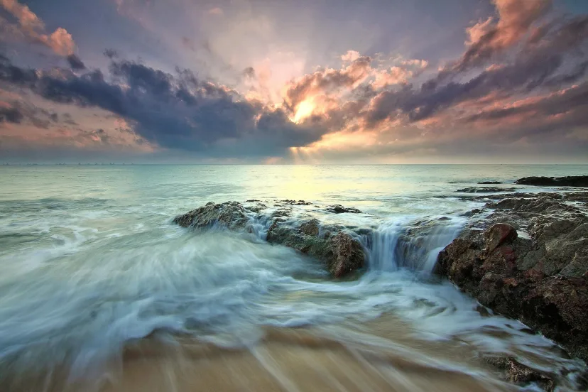 Sunset over a rocky coastline