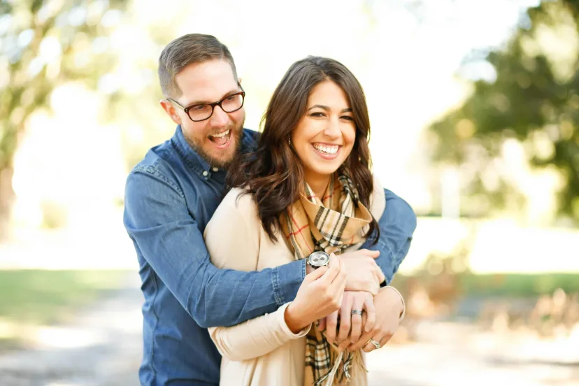 A couple standing together outdoors