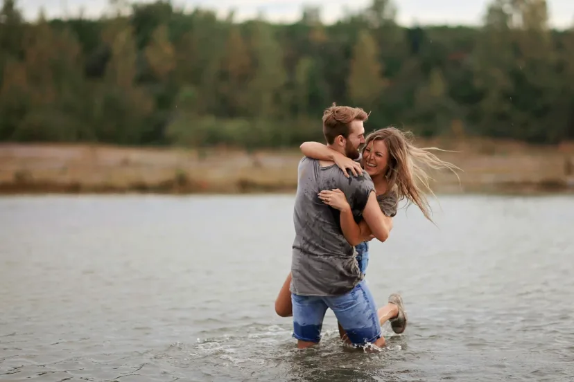 A family playing together in shallow water